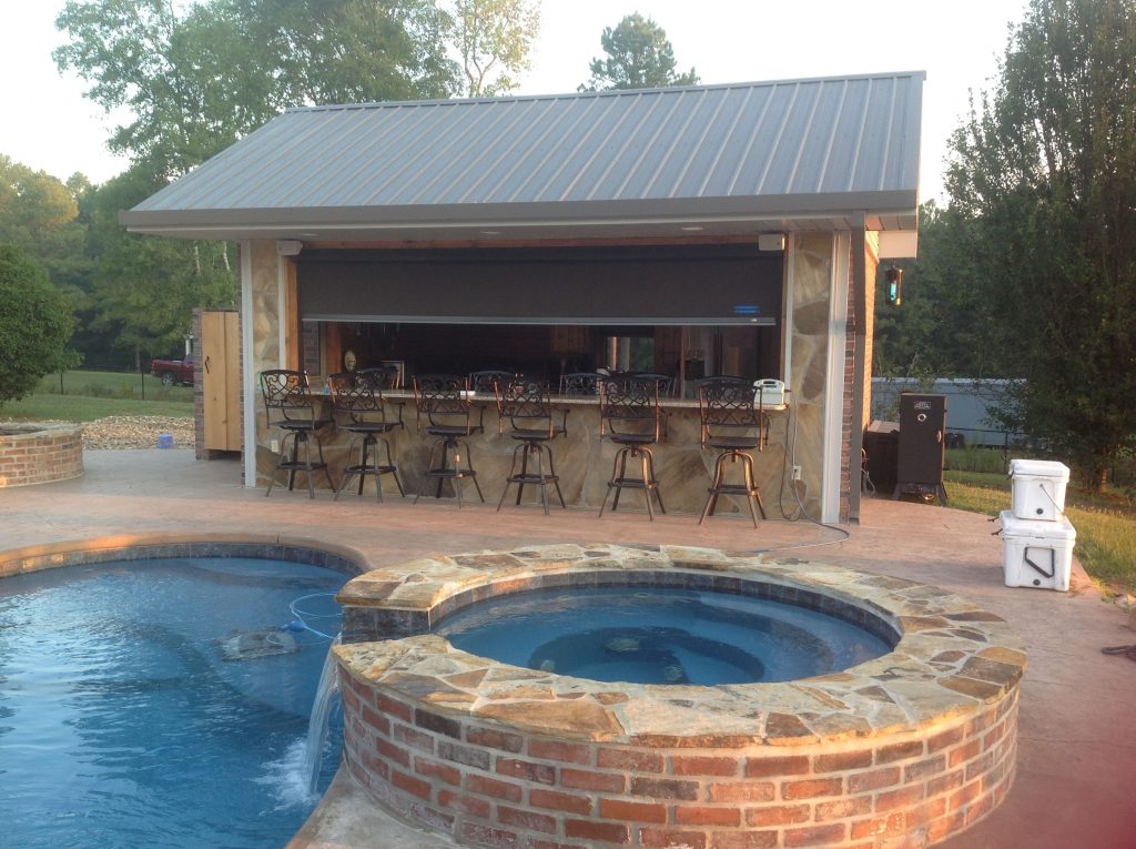 Pool bar with storm shutter protection